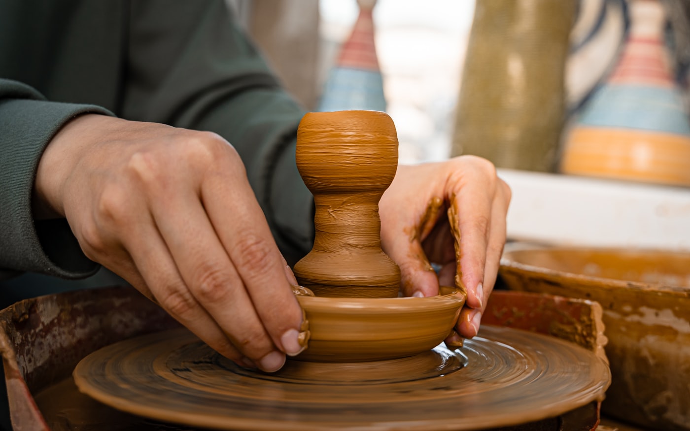 Shaping clay by hand in a creative workshop